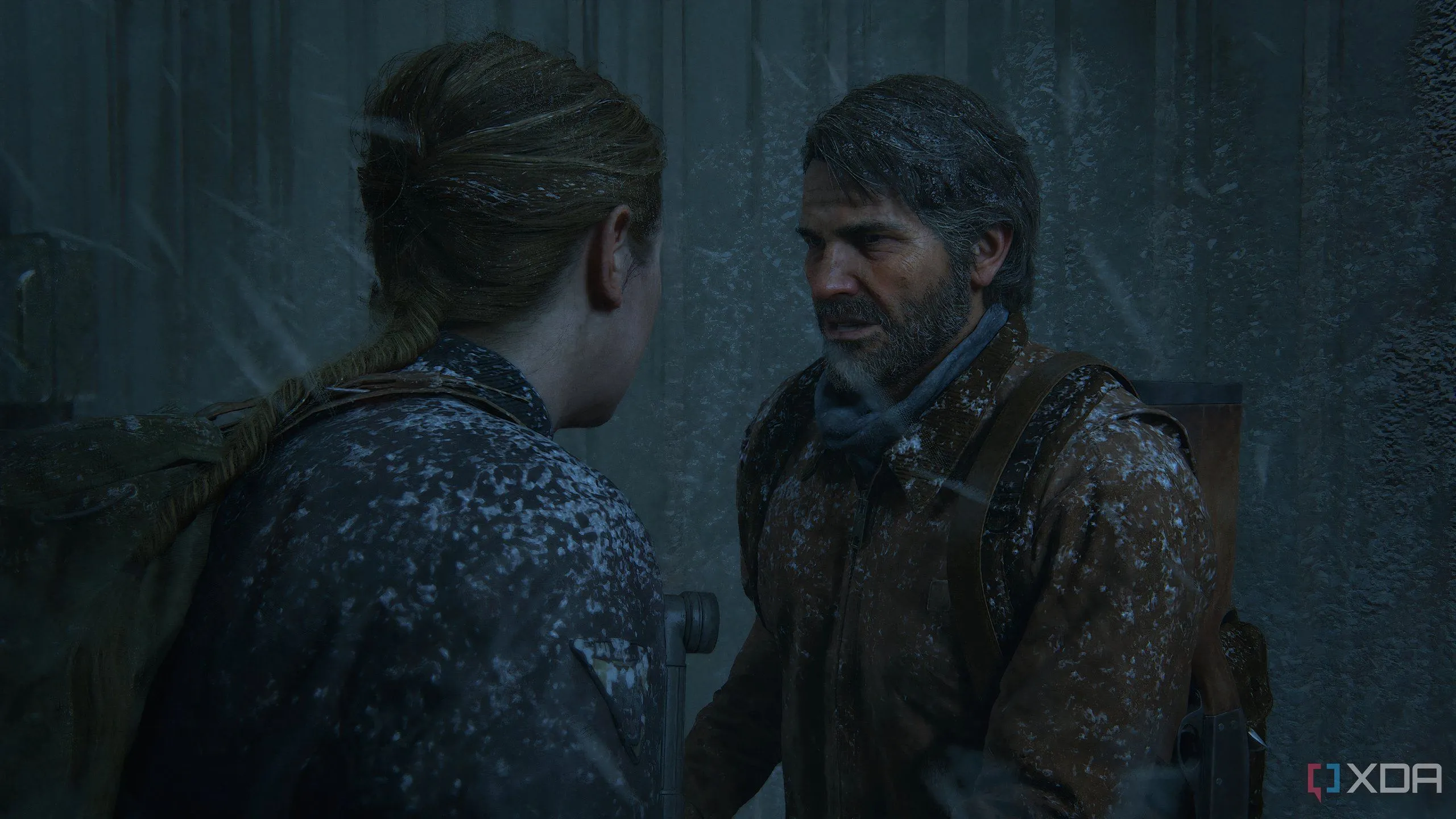 Cảnh game The Last of Us Part II Remastered trên PC cho thấy Joel và Abby trong bão tuyết