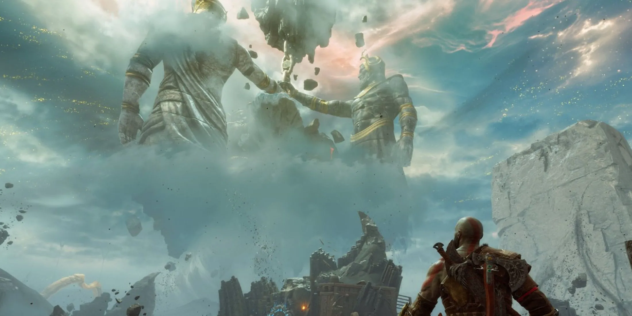 Kratos đứng trước những bức tượng khổng lồ trong phong cảnh thần bí của God of War Ragnarok