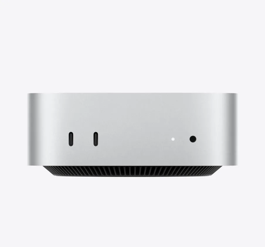 Máy tính Apple Mac Mini M4 nhỏ gọn trên bàn làm việc, minh họa thiết kế tối ưu không gian