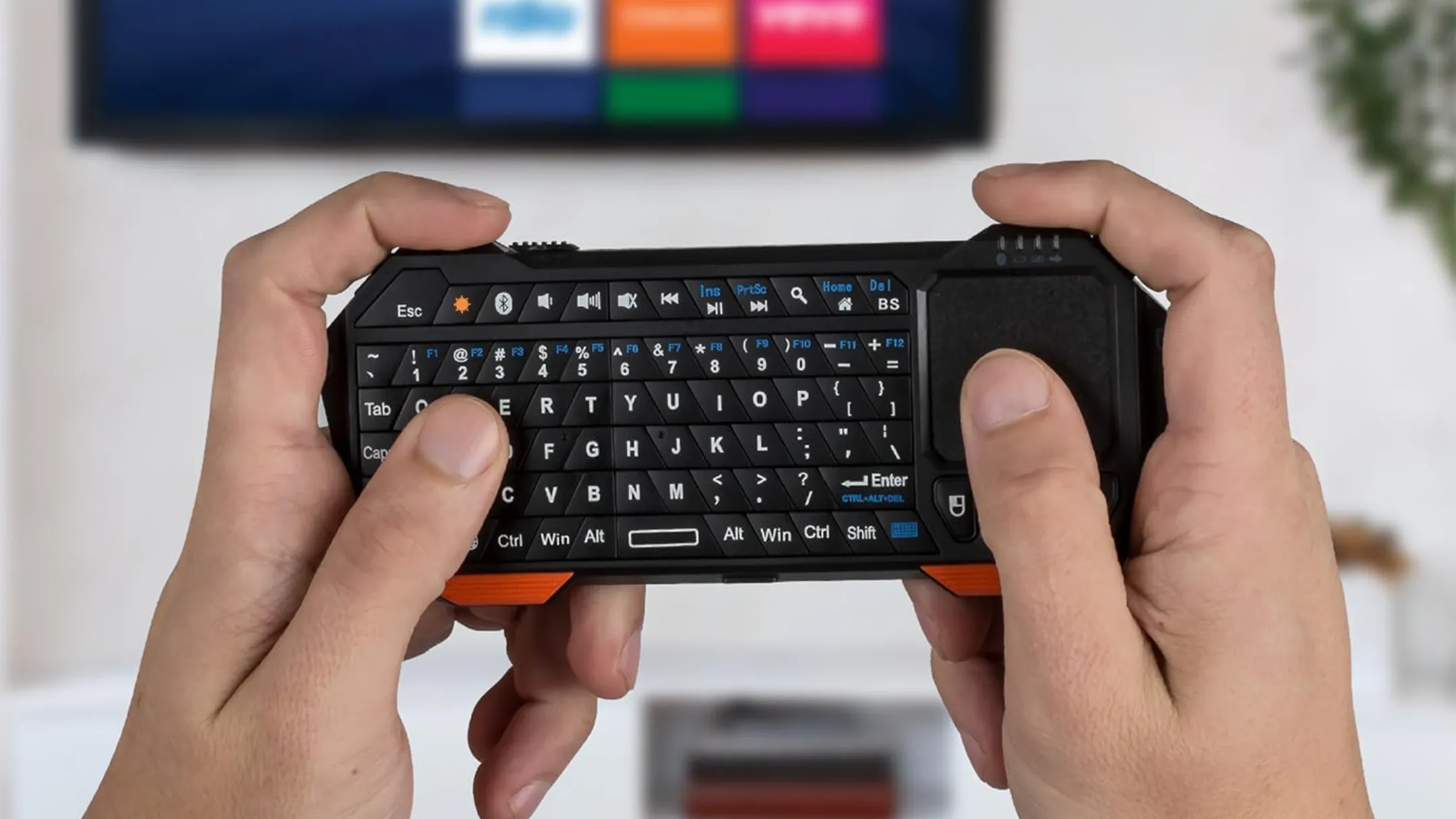 Mô tả các chức năng của bàn phím mini Fosmon: bàn phím QWERTY, touchpad và các nút điều khiển