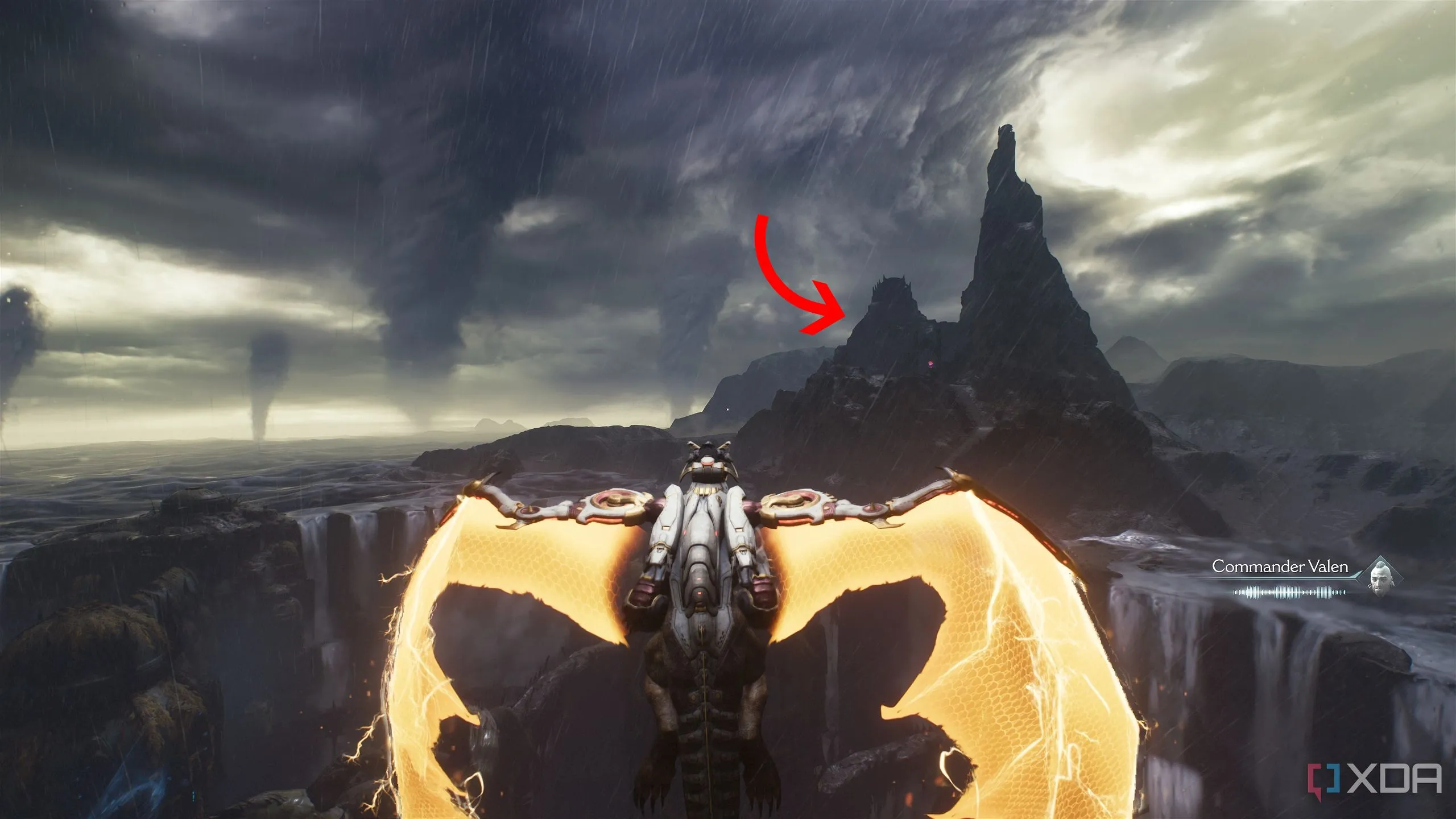 Mũi tên chỉ đến một ngọn đồi đá ở xa, nơi có khu vực bí mật 10 trong Chương 14 Doom The Dark Ages.